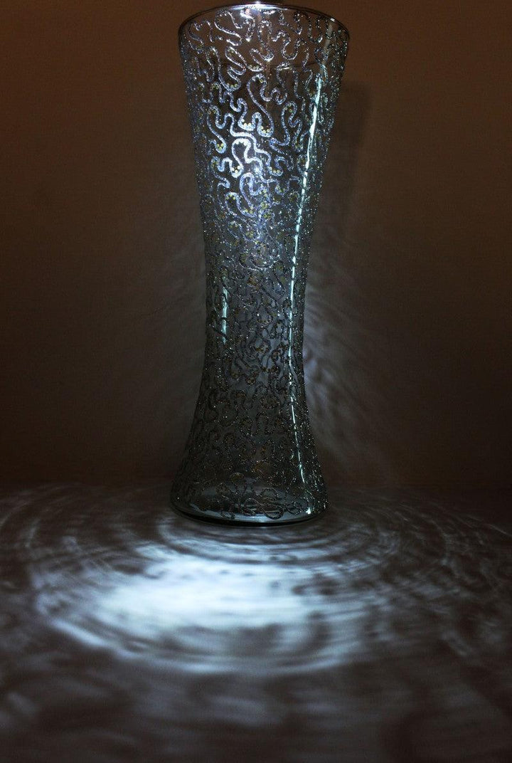 Abstract glass art titled 'Abstract glitter silver glass vase', 16x9x9 inches, by artist Shweta Vyas on glass