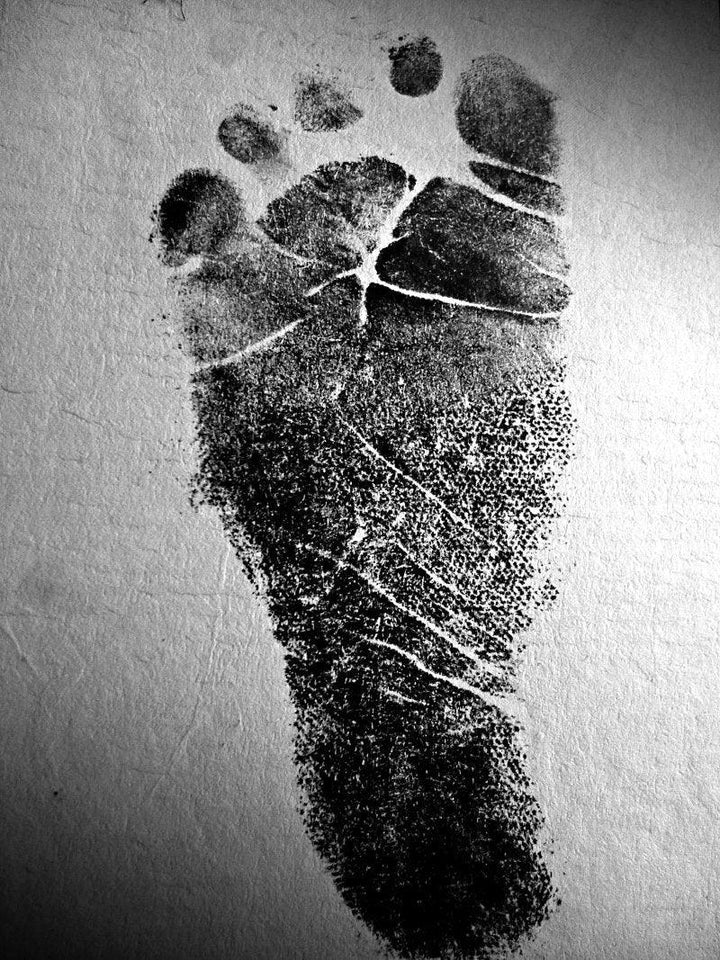 Figurative photography titled 'Babys Stamp Foot', 15x11 inches, by artist Rahmat Nugroho on