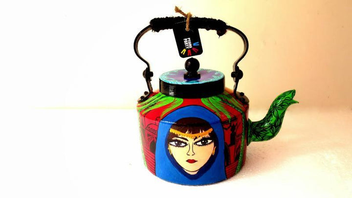 Lifestyle craft titled 'Banjara Tea Kettle', 9x9x7 inches, by artist Rithika Kumar on Aluminium