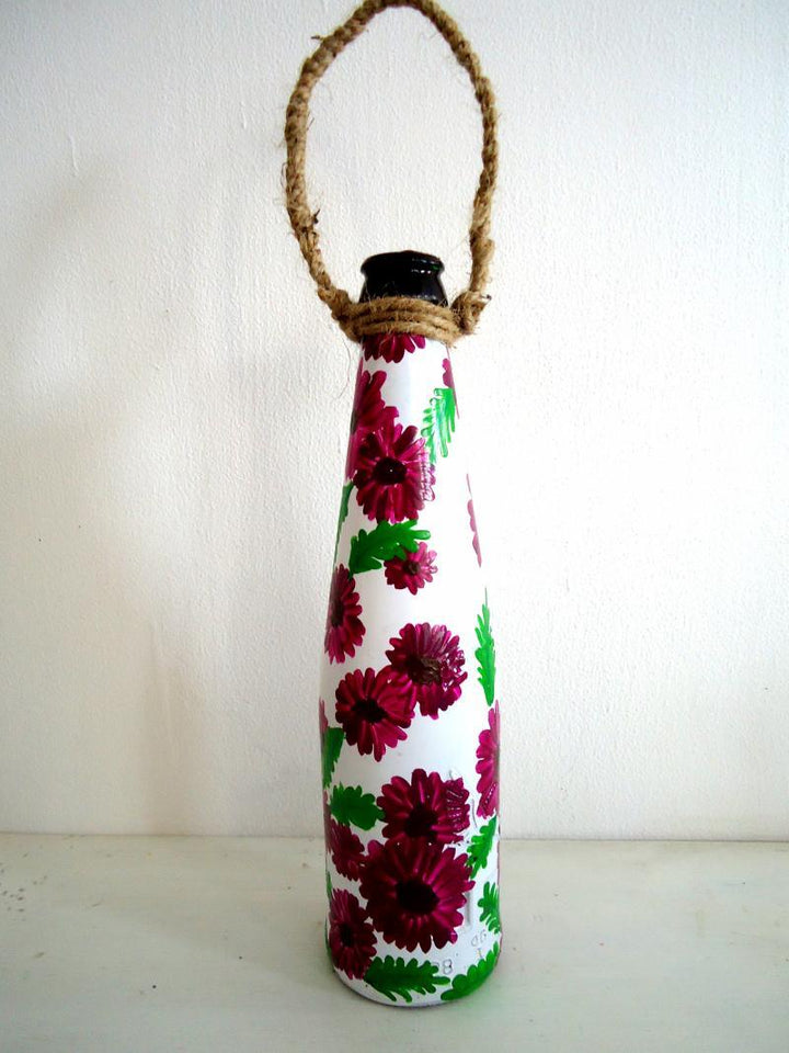 Lifestyle craft titled 'Bottle Planter Magenta', 9x3x9 inches, by artist Rithika Kumar on Recycled Glass