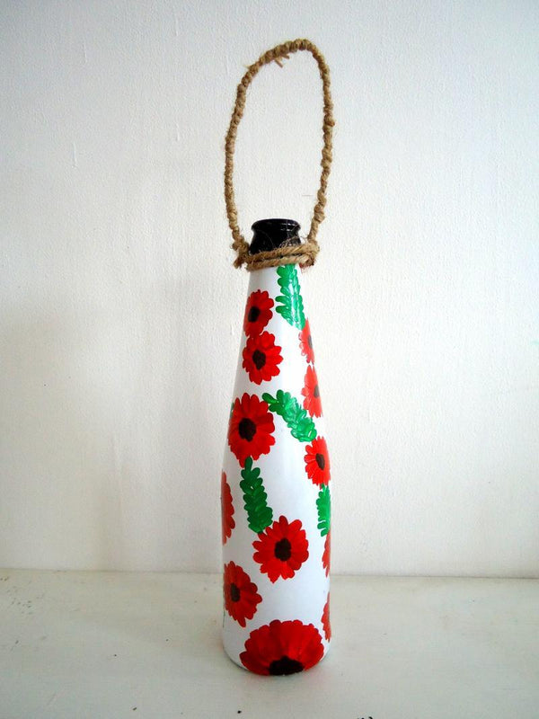 Lifestyle craft titled 'Bottle Planter Red', 9x3x9 inches, by artist Rithika Kumar on Recycled Glass