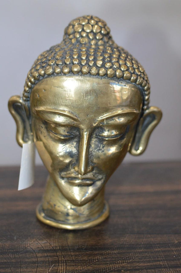 Religious sculpture titled 'Buddha Head', 7x4x3 inches, by artist Kushal Bhansali on Brass