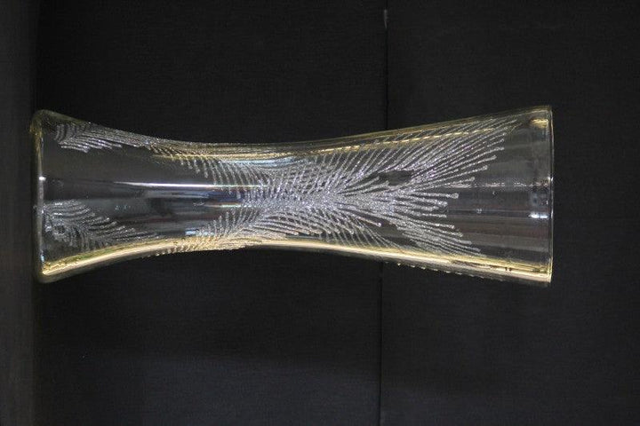 Abstract glass art titled 'Dancing feathers in glitter silver', 16x9x9 inches, by artist Shweta Vyas on glass