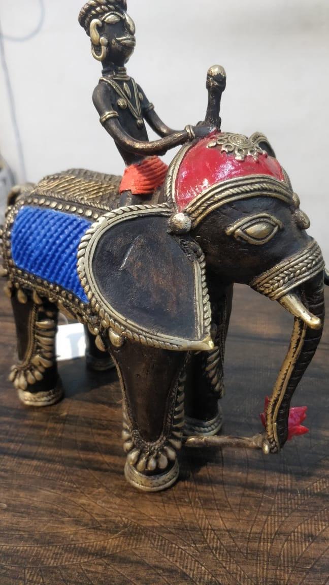 Animals sculpture titled 'Elephant With Man', 9x8x3 inches, by artist Kushal Bhansali on Brass