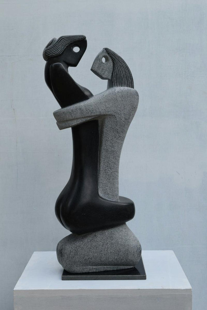 Figurative sculpture titled 'Embracing', 35x13x8 inches, by artist Pankaj Gahlot on Black Marble