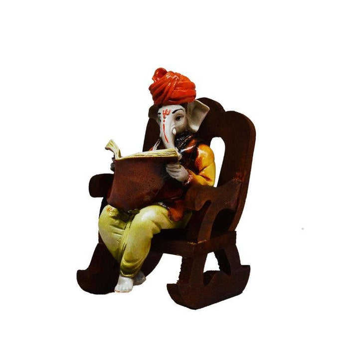 Religious craft titled 'Ganesha reading Book on Wooden Chair', 7x4x5 inches, by artist E Craft on Synthetic Fiber