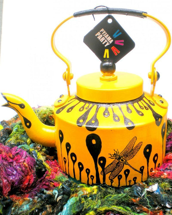 Lifestyle craft titled 'Hand Yellow Tea Kettle', 9x9x7 inches, by artist Rithika Kumar on Aluminium