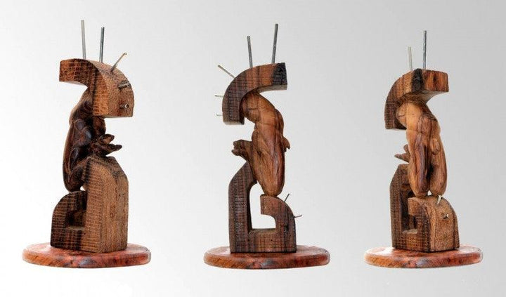 Figurative sculpture titled 'Hidden In My Life 8', 12x7x6 inches, by artist Dharam Netam on Wood, Metal