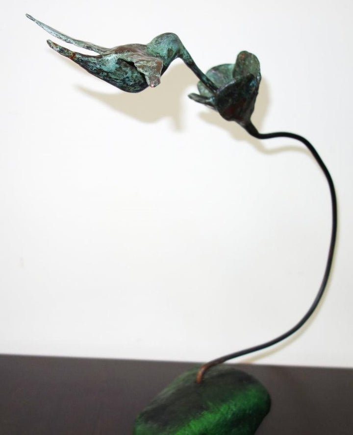 Figurative sculpture titled 'Humming Bird', 38x38x6 inches, by artist Usha Ramachandran on Bronze