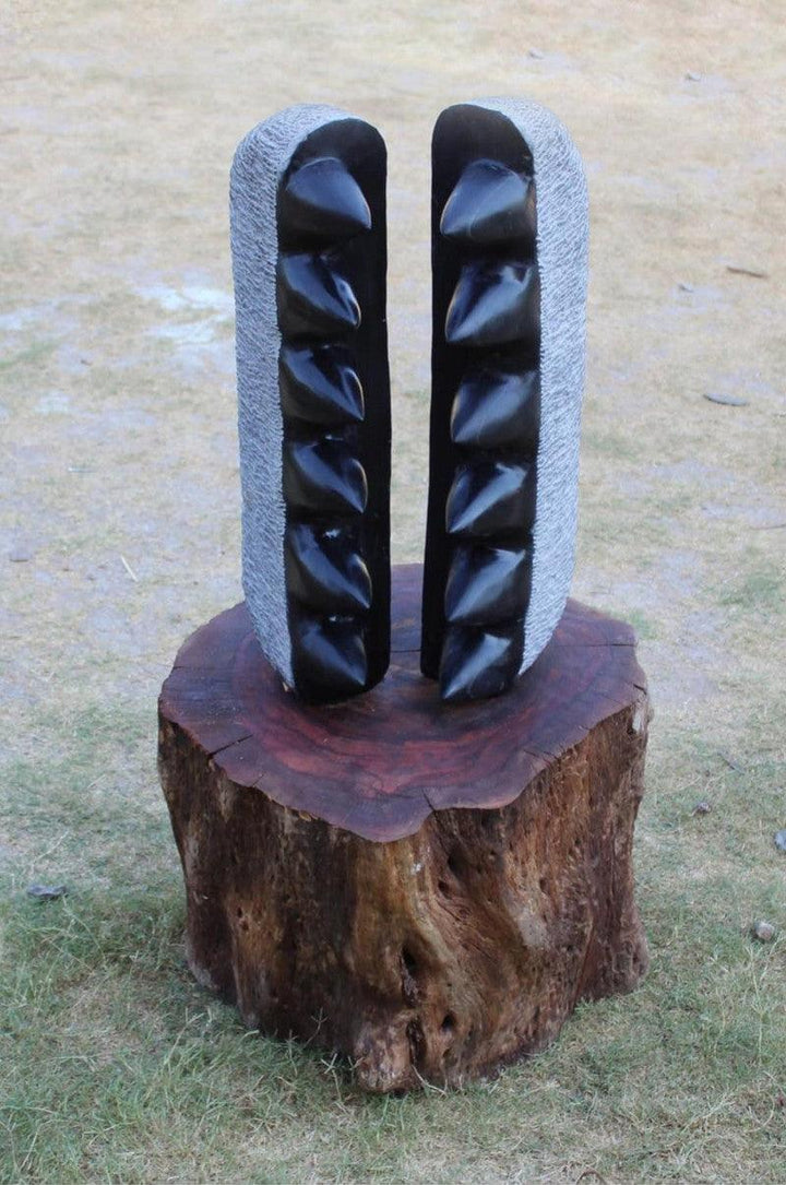 Abstract sculpture titled 'Is Their Any Space To Escape', 19x15x7 inches, by artist Tanzeem Baredia on Black Marble