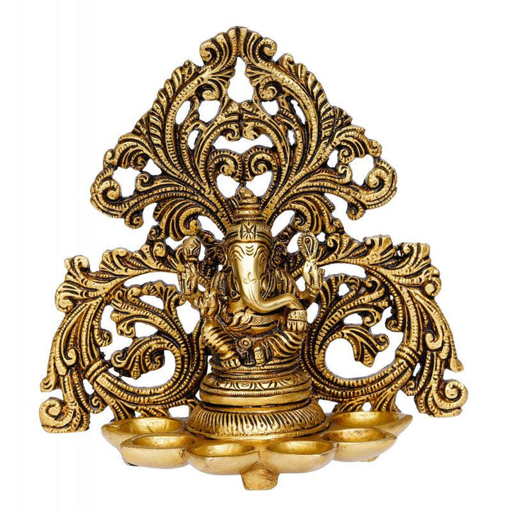 Religious handicraft titled 'Lord Ganesha Idol With 6 Diya Wicks', 7x7x4 inches, by artist Brass Handicrafts on Brass