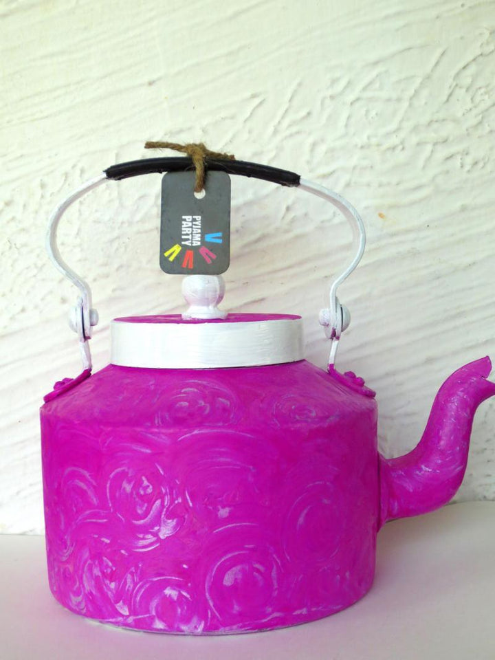 Lifestyle craft titled 'Magenta Magic Textured Tea Kettle', 9x9x7 inches, by artist Rithika Kumar on Aluminium