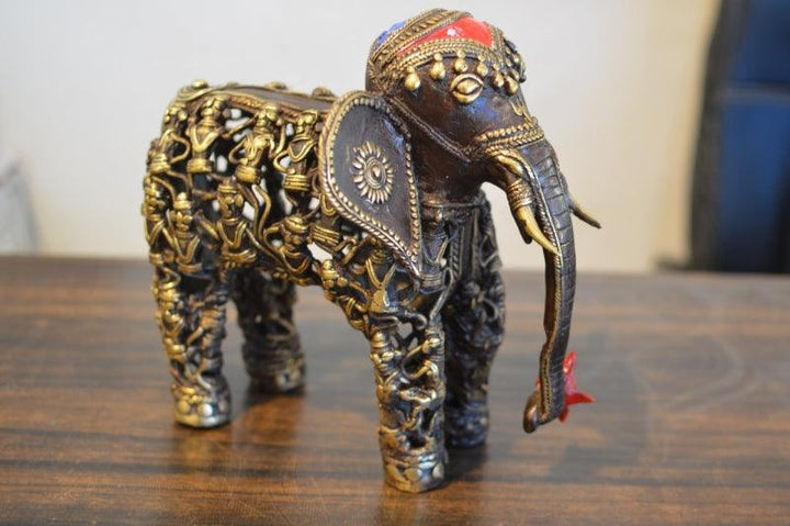 Animals sculpture titled 'Men Figure Elephant 5', 10x8x3 inches, by artist Kushal Bhansali on Brass