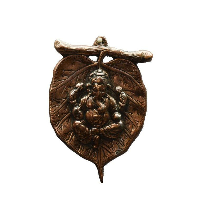 Religious craft titled 'Metal wall hanging of Ganesha on Leaf', 9x6x1 inches, by artist E Craft on Metal