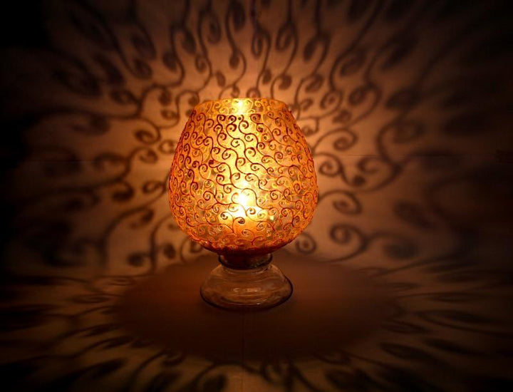 Abstract glass art titled 'Metallic Gold Swirls Candle Holder', 7x15x15 inches, by artist Shweta Vyas on glass