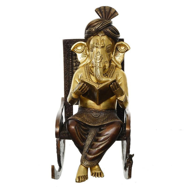 Religious handicraft titled 'One Lord Ganesha Reading Book and Sitting on Rocking Chair', 17x12x7 inches, by artist Brass Handicrafts on Brass