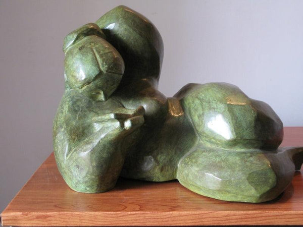 Figurative sculpture titled 'Reading 1', 11x16x11 inches, by artist Shankar Ghosh on Bronze