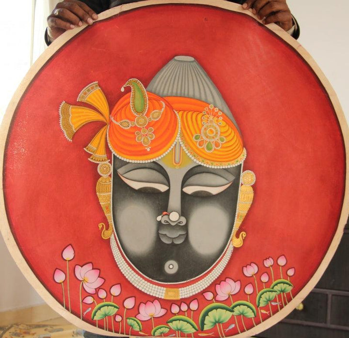 Religious pichwai traditional art titled 'Shrinath Ji Face Attire Pichwai Painting', 36x36 inches, by artist Yugdeepak Soni on Cloth