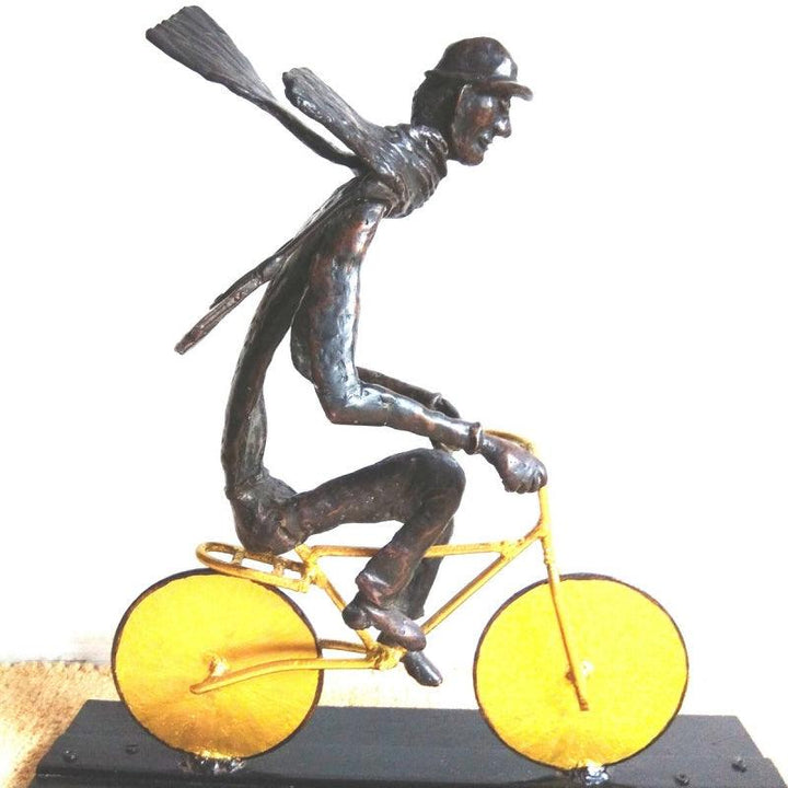 Figurative sculpture titled 'The Bicycle Rider', 17x17x6 inches, by artist Usha Ramachandran on Bronze, Steel