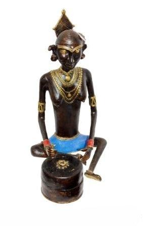 Figurative sculpture titled 'Tribal Working Lady 2', 21x11x12 inches, by artist Kushal Bhansali on Brass