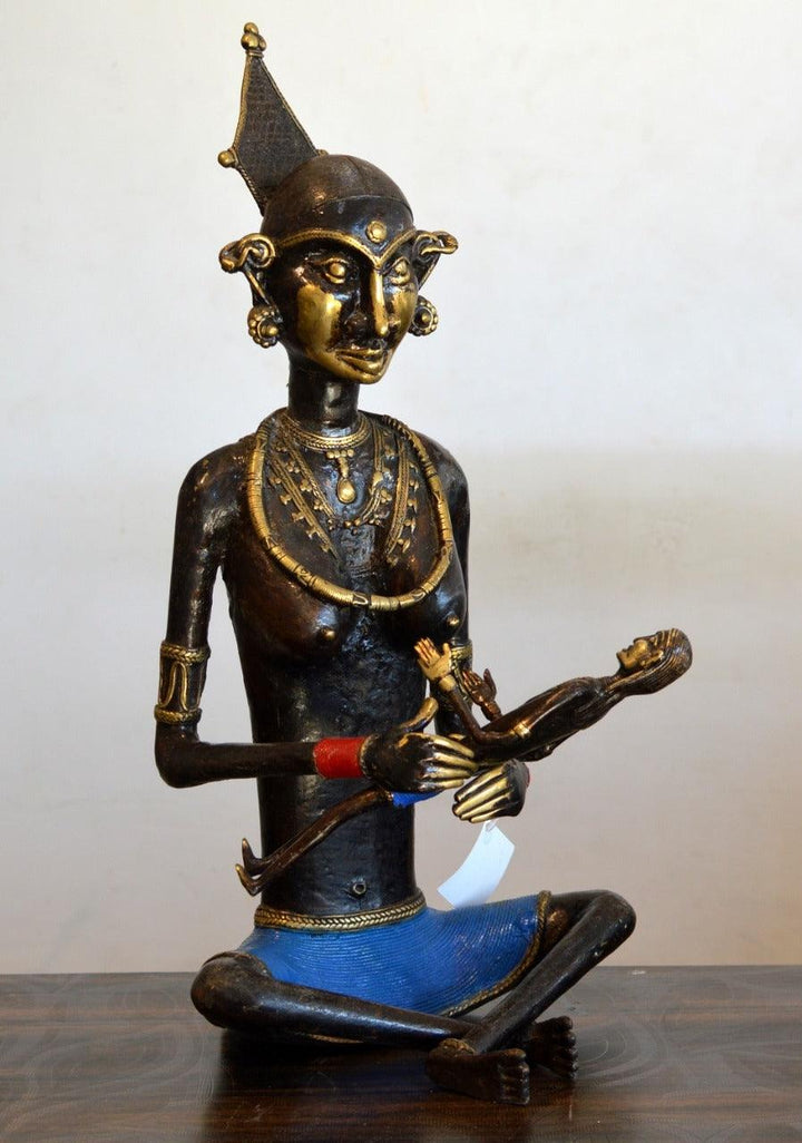 Figurative sculpture titled 'Tribal Working Lady Bachha Wali', 21x15x12 inches, by artist Kushal Bhansali on Brass