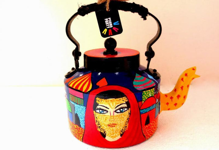 Lifestyle craft titled 'Veiled Woman Tea Kettle', 9x9x7 inches, by artist Rithika Kumar on Aluminium