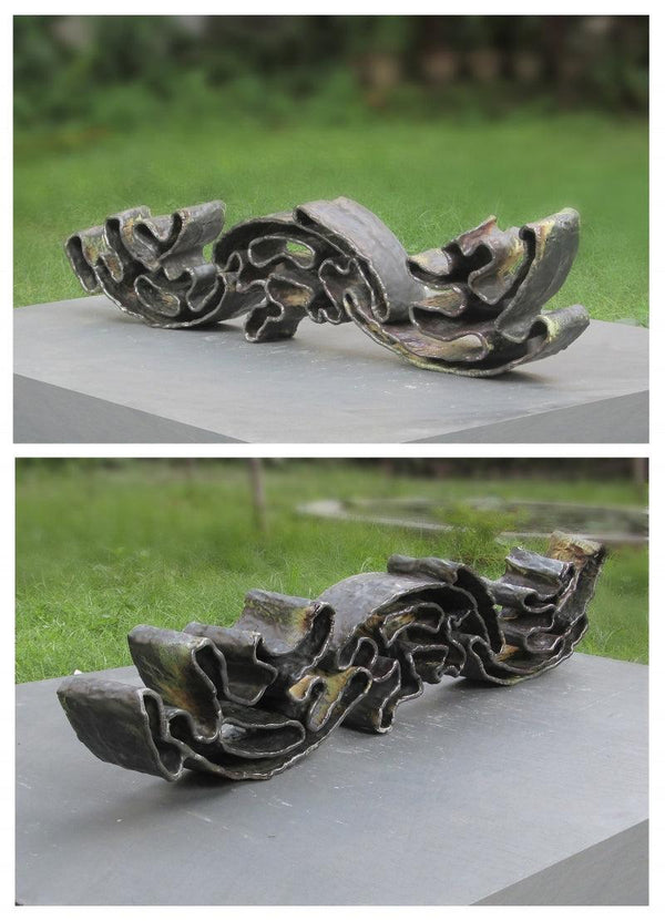 Abstract sculpture titled 'Wave', 36x15x12 inches, by artist Owanka Bhattacharjee on Ceramic