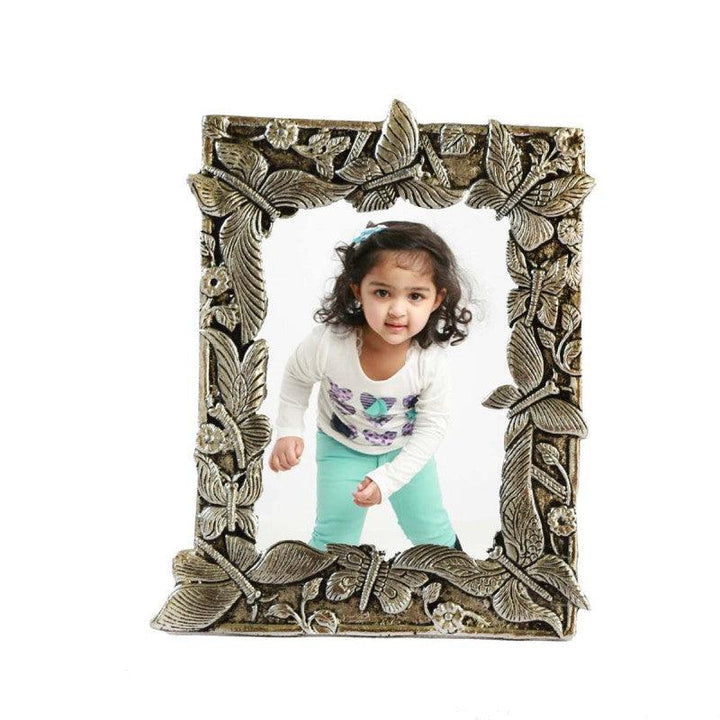 Lifestyle craft titled 'White Metal Leafy Design Photo Frame', 9x7x1 inches, by artist E Craft on Metal